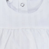 white ruffled sleeveless dress