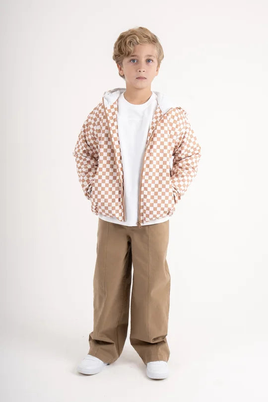 look: checkered waterproof jacket and coffee gabardine pants