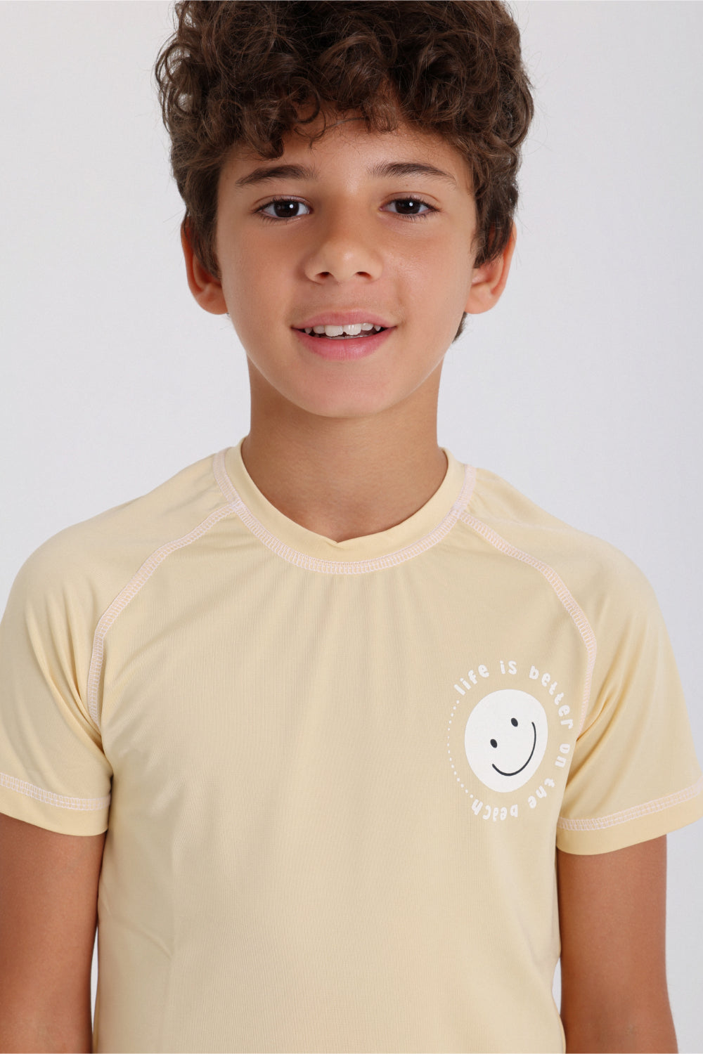 boys short sleeve rash guard – beige with "life is better on the beach" print