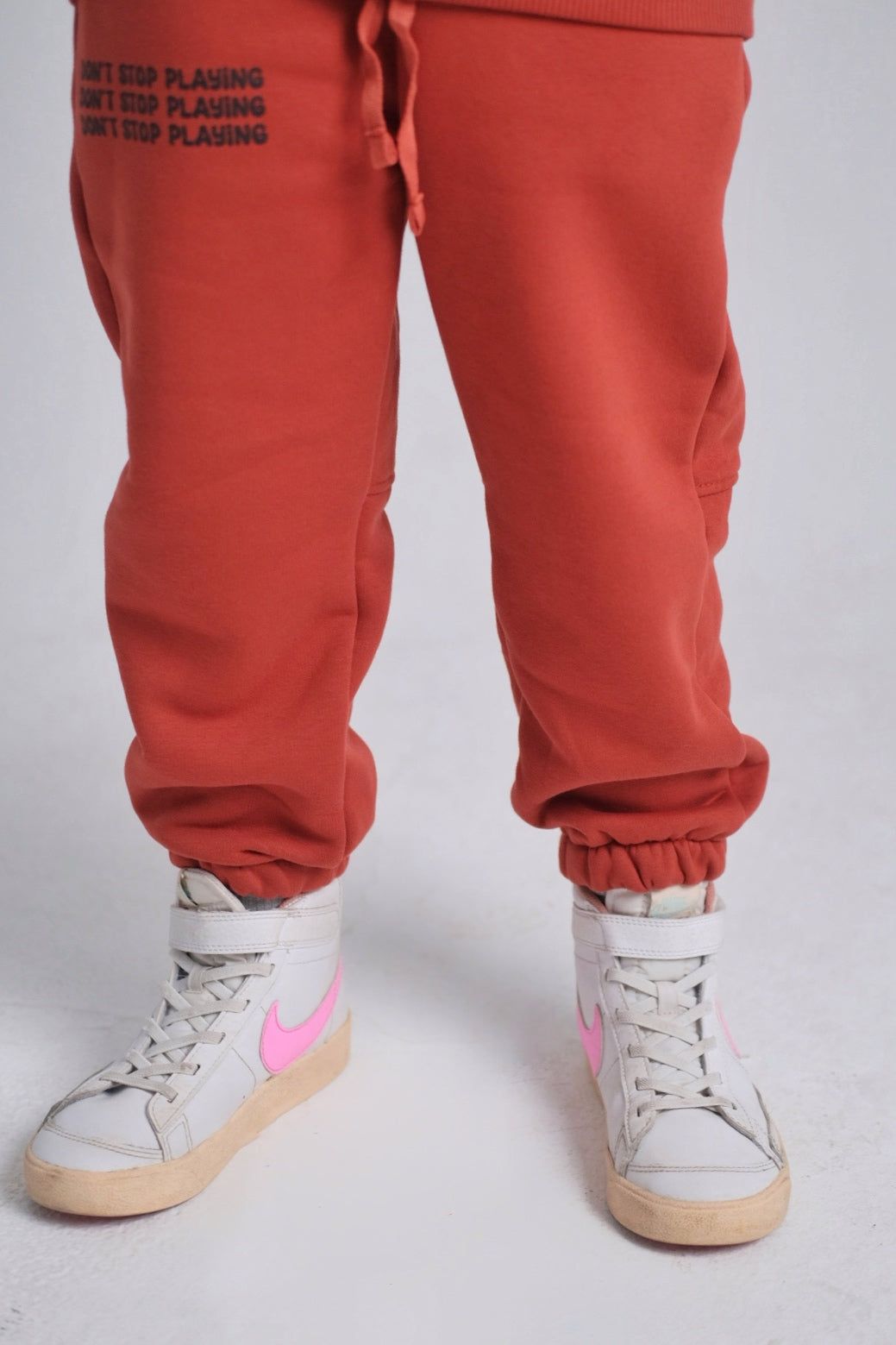 unisex brick "don't stop playing" sweatpants