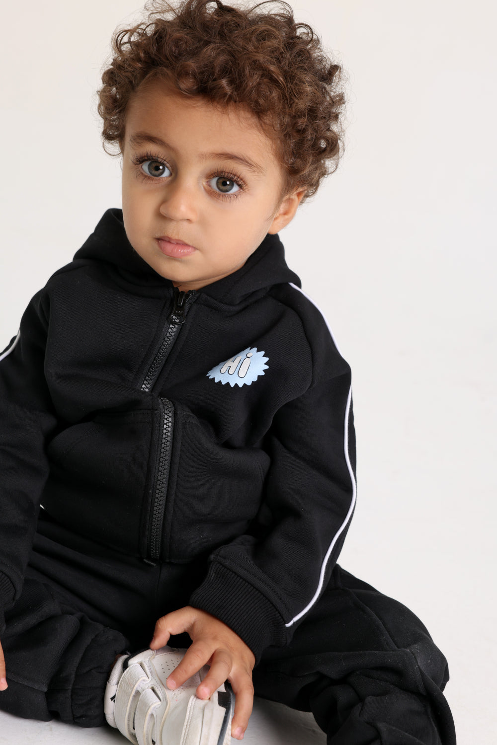unisex baby cotton hoodie – black with “hi“ design