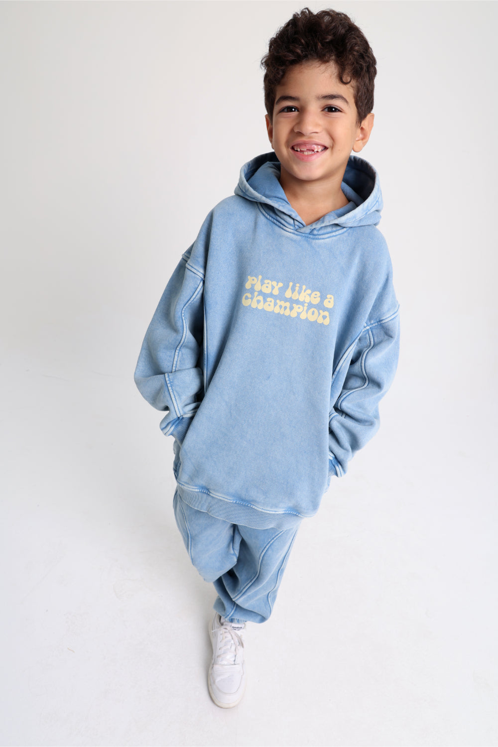 unisex cotton hoodie – baby blue with "play like a champion" print