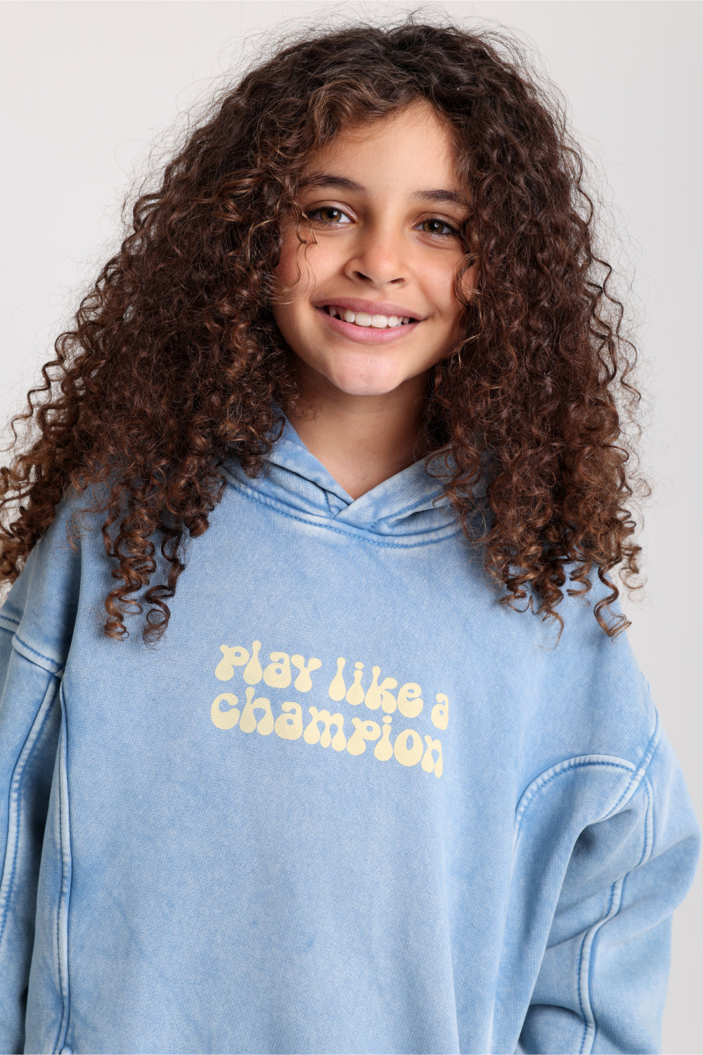 unisex cotton hoodie – baby blue with "play like a champion" print