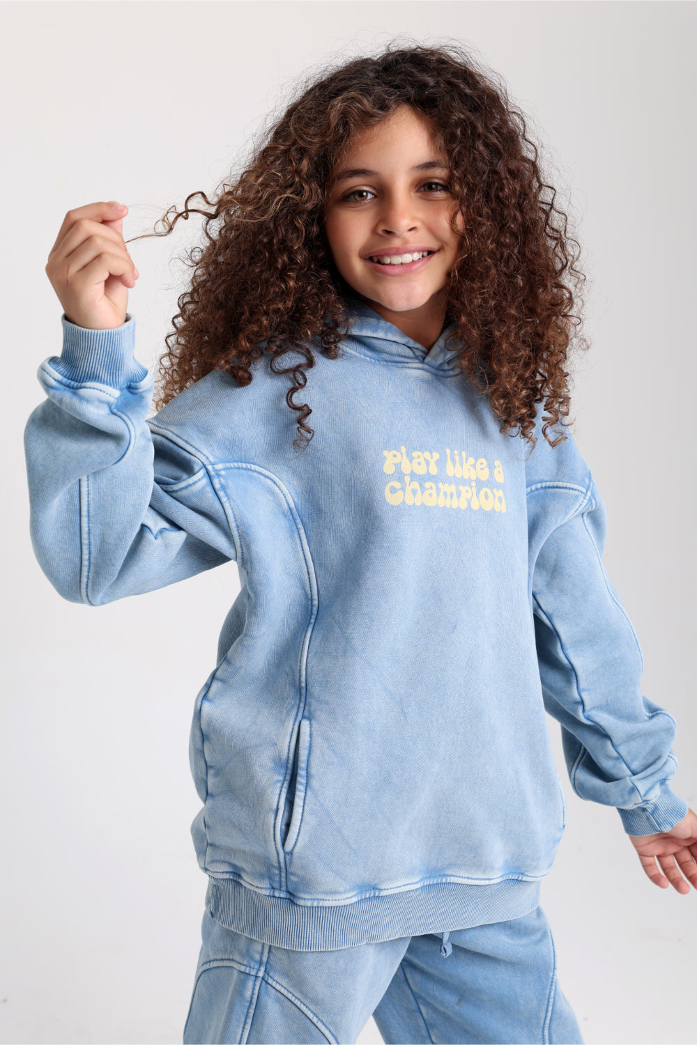 teens cotton hoodie – baby blue with "play like a champion" design